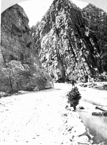 Ogden Canyon 3 miles above its mouth. A narrow gorge cut through the rocks, with walls 1,500 to 2,000 feet in height, the roadway being built up from the bed of the creek.