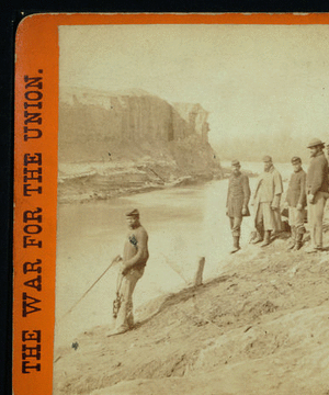 Dutch Gap canal and group of soldiers. Taken after the bank was blown out. On the extreme end a portion of the bank remains, which forms a profile, which the soldiers call Jeff Davis.