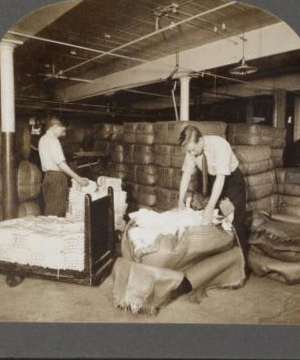 Opening bales of raw silk as it arrives from China, Japan and Italy. Silk industry (reeled silk), South Manchester, Conn., U.S.A. c1914 1914