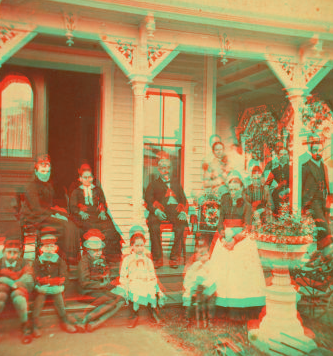 [Group posing on the porch of a cottage.] 1865?-1880?