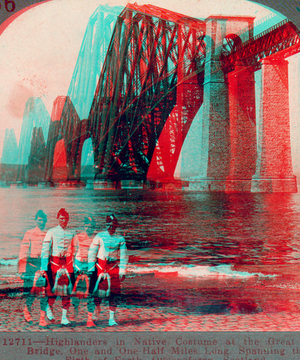 Highlanders in native costume at the great Forth Bridge, one and one-half miles long, spanning the Firth of Forth, Queensferry, Scotland