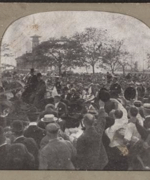 Castle Garden, now the aquarium, with a very interesting foreground [large crowd of people, some waving at a procession, in foreground]. 1865?-1910?