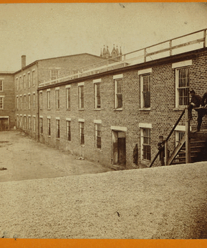 Tobacco warehouse on High St. Petersburgh, [sic], Va., used by the rebels as temporary prisons. View from the south side.