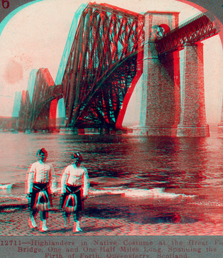 Highlanders in native costume at the great Forth Bridge, one and one-half miles long, spanning the Firth of Forth, Queensferry, Scotland