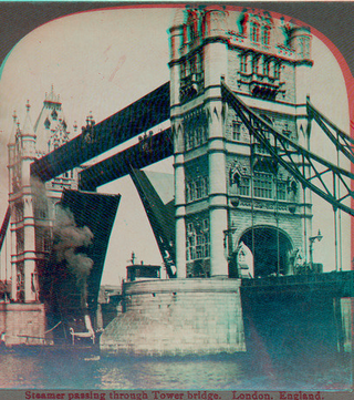 Steamer passing through Tower Bridge, London, England