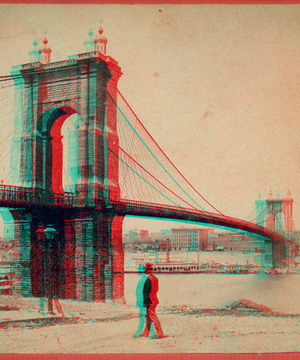 Cincinnati-Covington Bridge with pedestrian in foreground and buildings in background