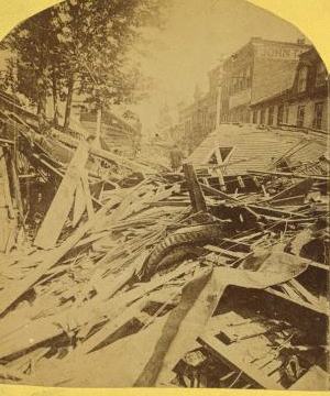 Main St., from Franklin St., wreckage 40 ft. high. 1880?-1895?